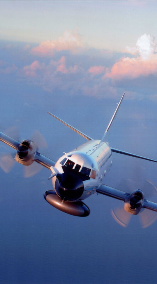 A hurricane-hunter aircraft is flying through the sky.